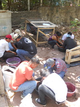 Three groups preparing briquette materials