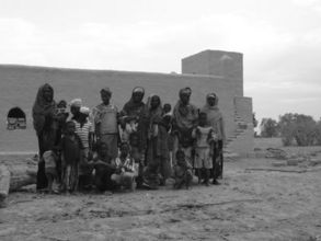 Villagers outside the mosque site