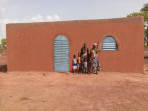 A family in front of their NV house