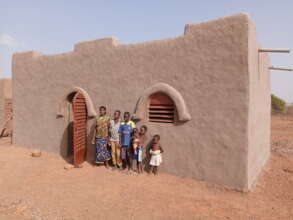 A family in front of their NV house