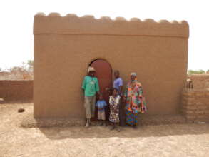 A family in front of their NV house