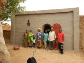 A family in front of their NV house