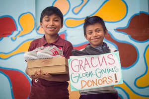 Jose & Edwin receive their new shoes!