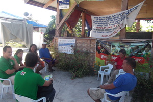 A consultation meeting with recipient community
