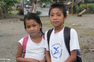 Marlyn (left) goes to school despite meningitis.