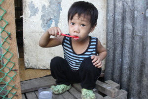Bibo, 5, prepares for school after breakfast.