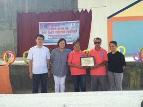 CJFI execs give certificate of donation to brgy.