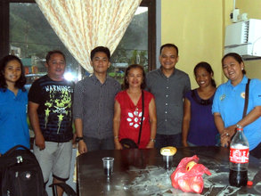 Officials and leaders of a recipient community