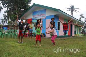 Happy kids outside their new day care center