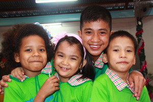 Joyous smiles of CJFI kids after a Christmas party