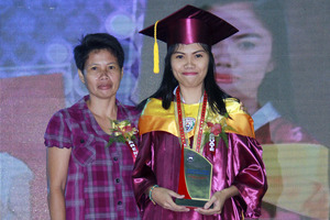 Regine, standing proud with her mother