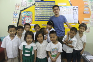 With her teacher and classmates