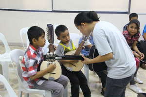 CJFI kids in musical lesson