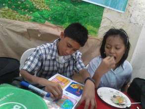 CJFI Kid doing school project