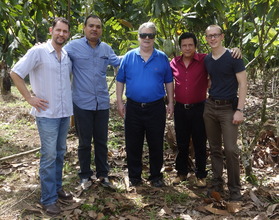 Project Leaders Pose in A Member's Cacao Field