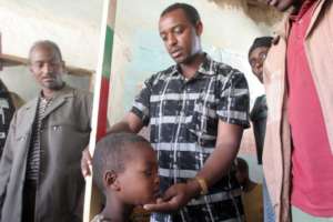 A health care worker assesses Abdulmejid