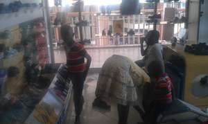 kids trying out shoes at bata shoe shop in kampala