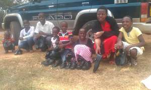 some of the children pause for aphoto with shoes