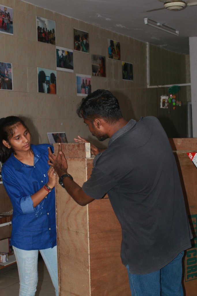 Pinky discussing her solution with a consultant