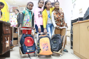 Girls Proudly Exhibit Their Wooden Trolleys Design
