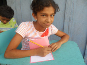 Maria writing a story for her friend Bibliobandido