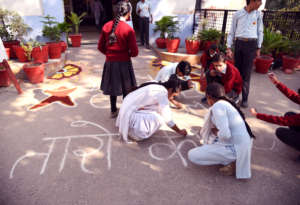 Boys & girls working together at school