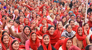 Health workers at a community event in Haryana