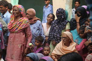 Womenfolk watching a street theater performance