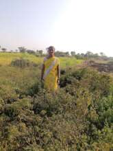 Kavita with her plot of land