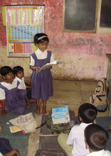 Harshida reading to the class