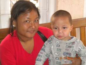A mother with her child in the safe home