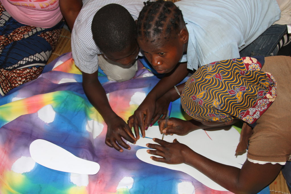 Making shoes for barefoot children in Mozambique