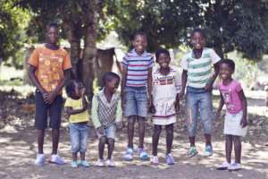 Children in Macuane wearing their first shoes