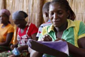 Mothers in Macuane making KLEMs