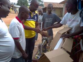 A training participant receives supplies