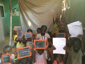 Teacher Brenda with HOCW's youngest students.