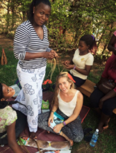 Volunteer Kelly having her hair braided