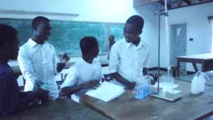 Students interacting with chemistry tools