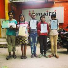 Children show their certificates from sports event