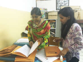 Teacher filing individual progress of students