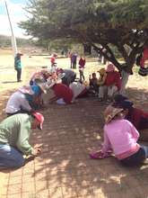 Families help build school rainwater cisterns