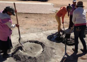Community women mixing cement