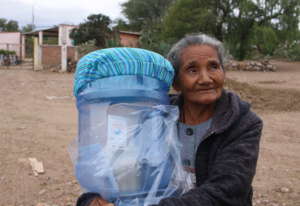 Woman in Llano Verde receives her filter system