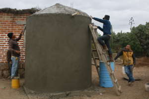 Finishing up a cistern in a local community