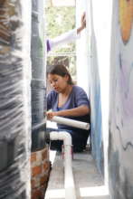 A mother learns to install plumbing