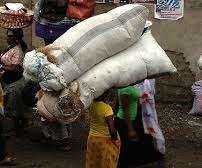 Kayayoo carrying Large, Heavy Load to Earn Pesewas
