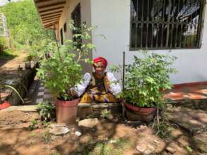 Woman farmer in Colombia planting heirloom veggies