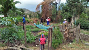 Ann at her nursery with several farmers
