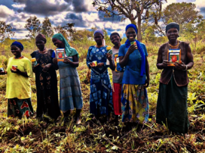 Women with seed for their garden plots