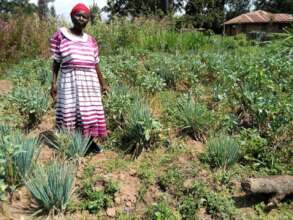 Kenyan widow in her permaculture garden